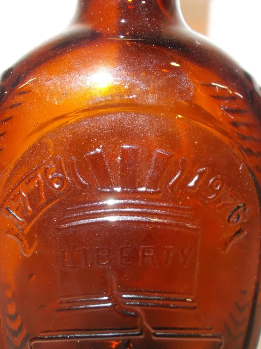 1976 Vintage Log Cabin Syrup Liberty Bell bicentennial bottle, amber color EMPTY
